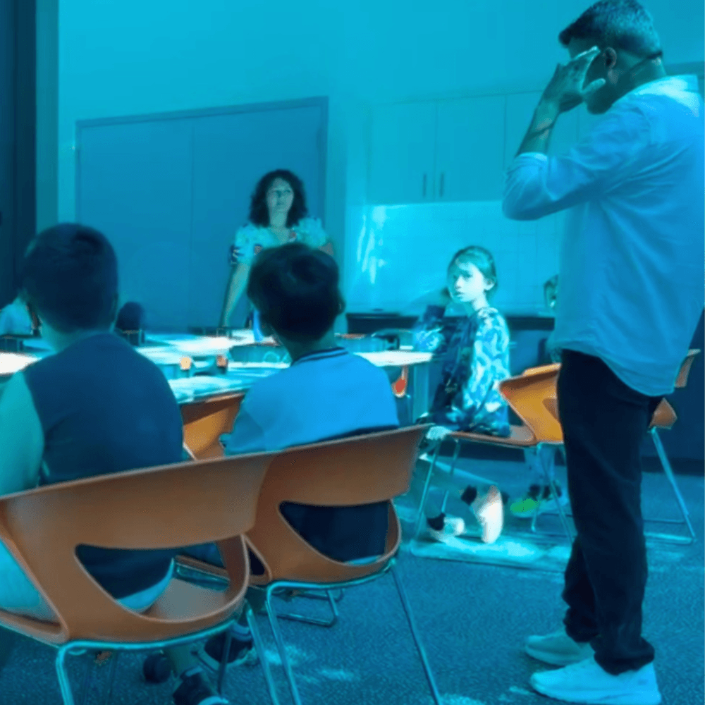 Child assembling a robot during a ThinkerLab after-school robotics workshop in Melbourne
